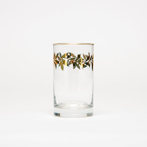 Color of abundance #7: Water glass decorated with golden flowery patterns